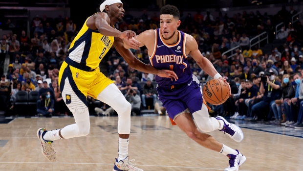 Justin Holiday and Devin Booker, Getty Images Justin Holiday and Devin Booker