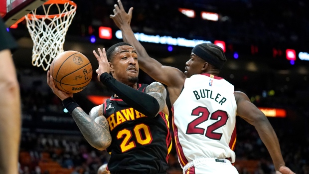John Collins and Jimmy Butler, The Canadian Press John Collins and Jimmy Butler