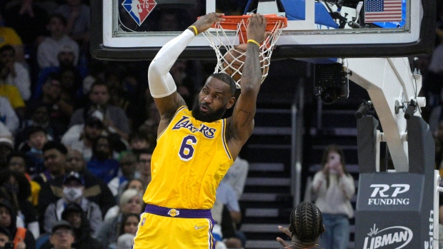 James scores 29, plays center as Lakers rally past Magic