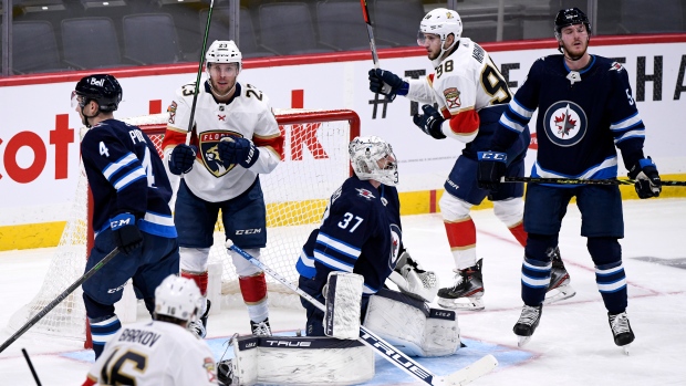 Carter Verhaeghe Connor Hellebuyck Maxim Mamin