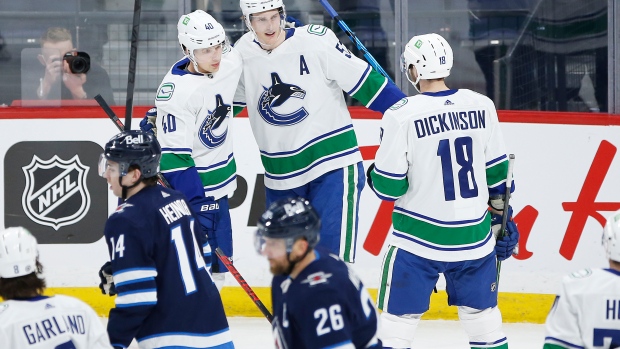 Canucks celebrate vs. Jets