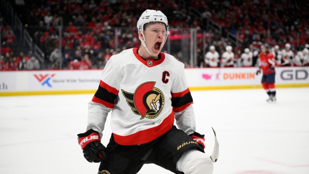 Brady Tkachuk of the Ottawa Senators pulls out a belt celebration