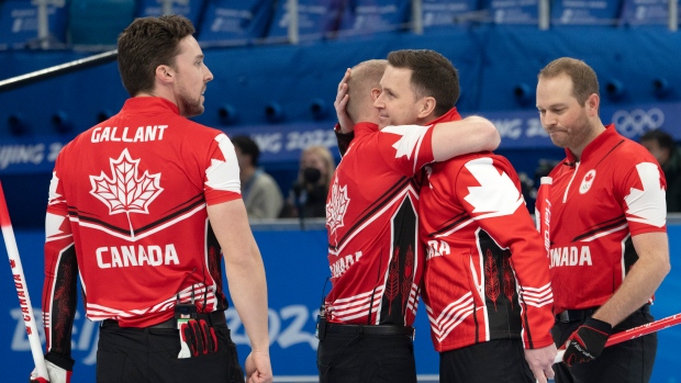 Team Canada men's curling celebrates