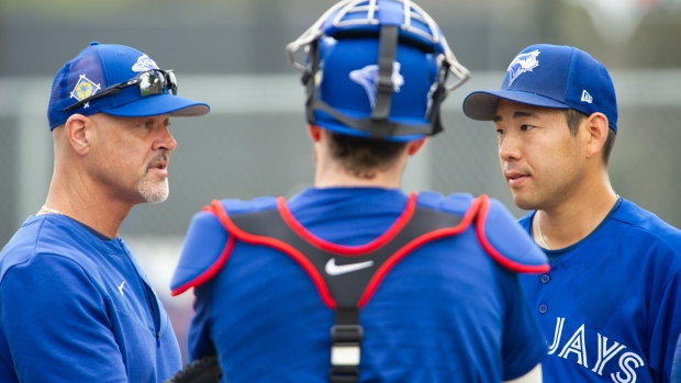 Pitching coach Pete Walker and Yusei Kikuchi