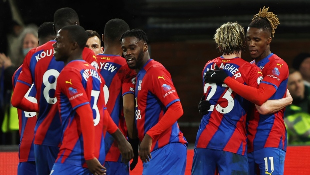 Crystal Palace players celebrate Wilfried Zaha