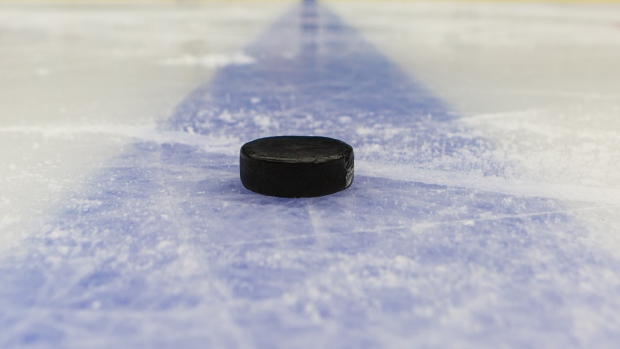 Puck on ice, The Canadian Press Puck on ice