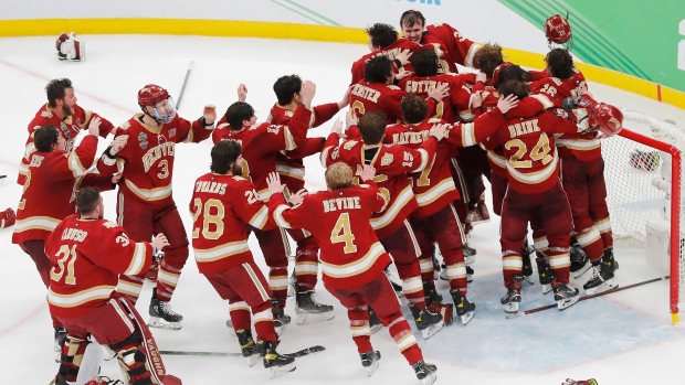 Denver Pioneers celebrate, The Canadian Press Denver Pioneers celebrate