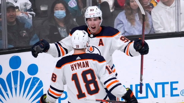 Ryan Nugent-Hopkins and Zach Hyman celebrate