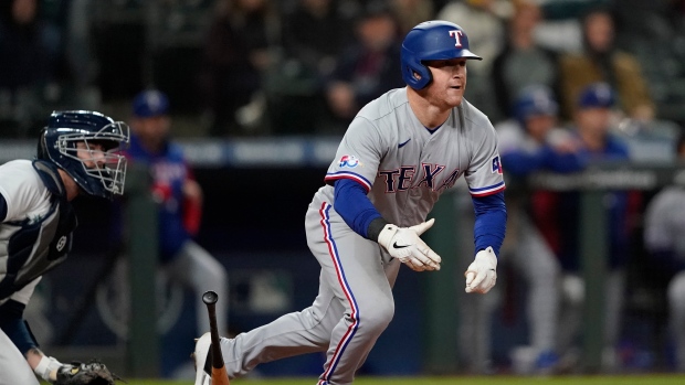 Rangers rally twice over Mariners, snap 14-game road skid