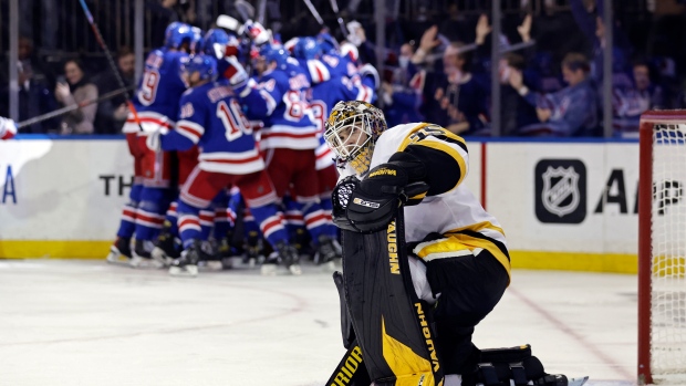 New York Rangers Celebrate behind Tristan Jarry