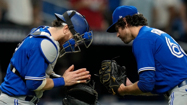 Jordan Romano, Danny Jansen, The Canadian Press Jordan Romano, Danny Jansen