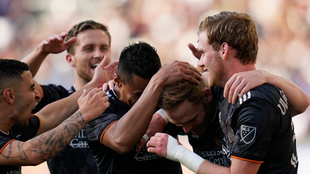 Houston Dynamo celebrate, The Canadian Press Houston Dynamo celebrate