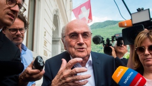 Smiling Blatter enters court at start of FIFA fraud trial