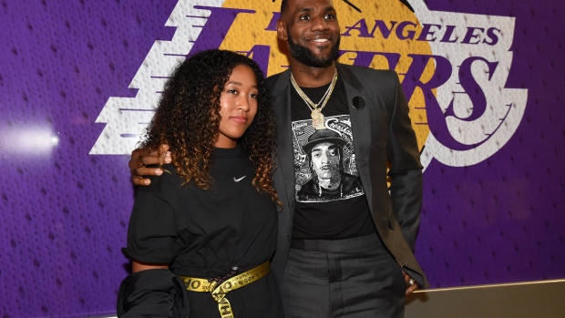 Naomi Osaka poses with LeBron James in 2019