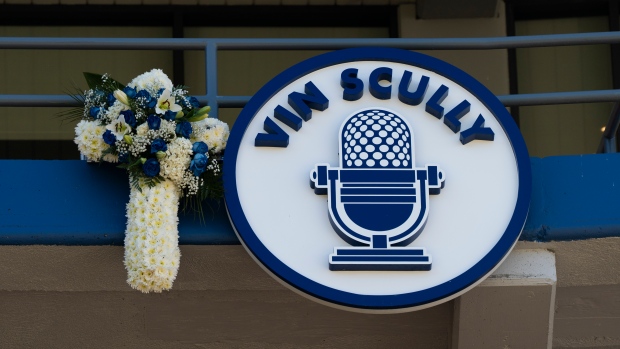 Scully honored with video tribute, banner at Dodger Stadium