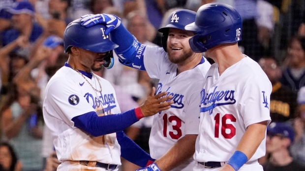 Max Muncy, Mookie Betts and Will Smith, The Canadian Press Max Muncy, Mookie Betts and Will Smith