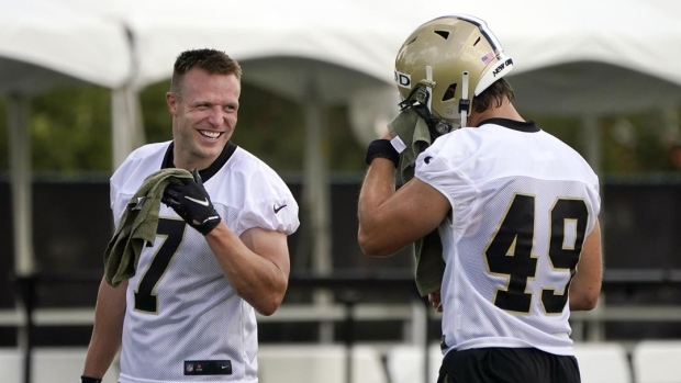 Taysom Hill and Zach Wood, The Canadian Press Taysom Hill and Zach Wood