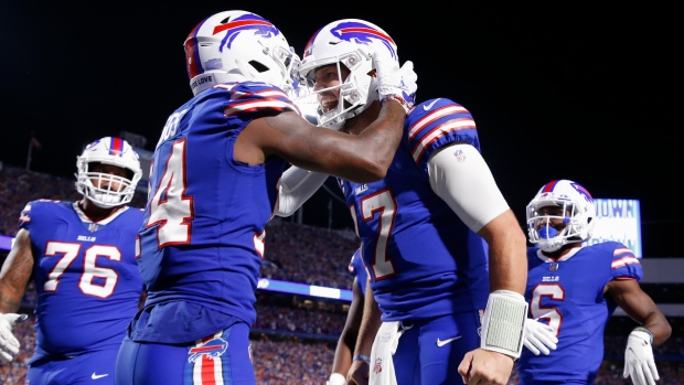 Stefon Diggs and Josh Allen, The Canadian Press Stefon Diggs and Josh Allen