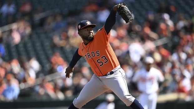 Astros break through for four in 11th, slow Orioles playoff push