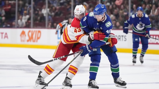 Calgary Flames' Adam Klapka and Vancouver Canucks' Elias Petterson, The Canadian Press Calgary Flames' Adam Klapka and Vancouver Canucks' Elias Petterson