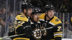 Patrice Bergeron, Brad Marchand and Charlie McAvoy