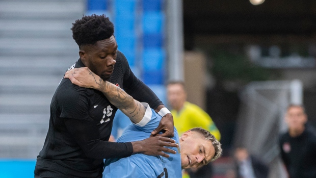 Alphonso Davies and Martin Caceres, The Canadian Press Alphonso Davies and Martin Caceres