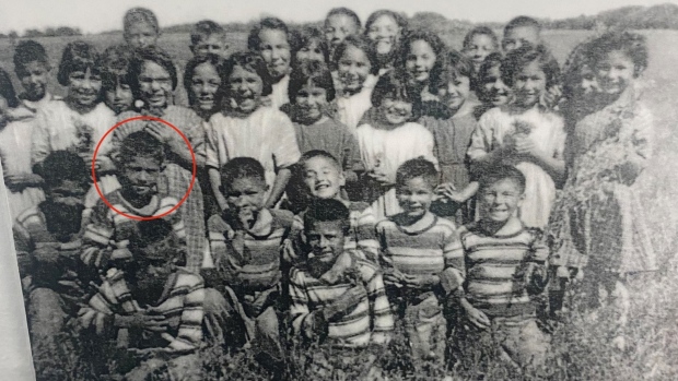 Eugene Arcand’s class picture from St. Michael’s. Eugene is circled in red.