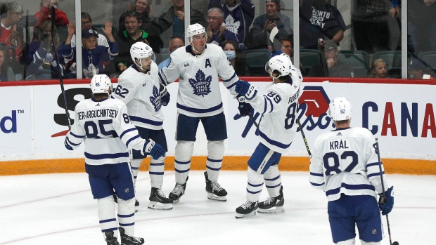 The Barenaked Ladies don Toronto Maple Leaf jerseys and sing the national  anthem on center ice before the game as the Leafs host the Ottawa Senators  on opening night of the new