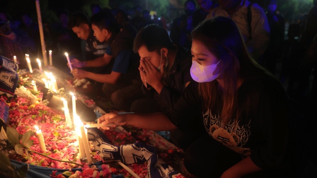 Relatives mourn loved ones after tragedy at soccer match, The Canadian Press Relatives mourn loved ones after tragedy at soccer match