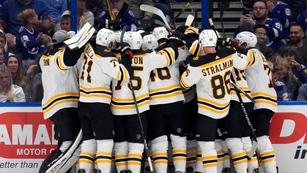Boston Bruins celebrate with Patrice Bergeron