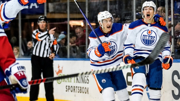Oilers score four times in third period to defeat Rangers