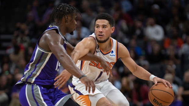 Davion Mitchell Devin Booker, The Canadian Press Davion Mitchell Devin Booker