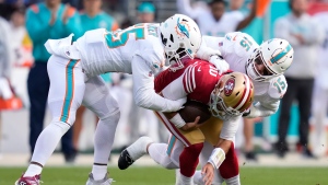 49ers' Garoppolo done for season after breaking foot against Dolphins