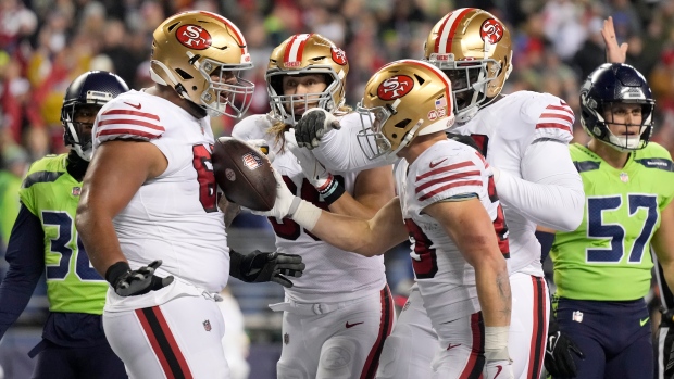 Christian McCaffrey San Francisco 49ers celebrate