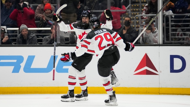 Danielle Serdchny (92) celebrates with Marie-Philip Poulin (29)