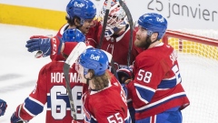 Sam Montembeault celebrates with teammates