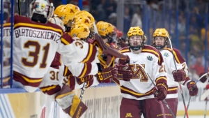 Gophers score four goals in third, advance past Boston University in Frozen Four