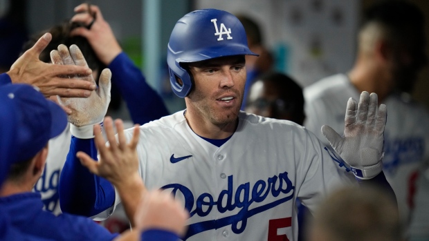 Freeman has four hits, extends hitting streak to power Dodgers over Nationals