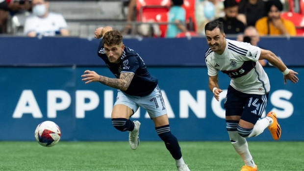 Late penalty helps Whitecaps claim point in draw with Sporting KC