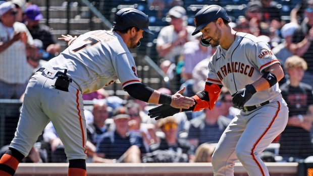 Giants use three-run 9th to beat Rockies for 11th straight time