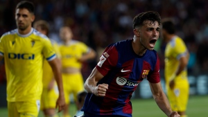 Barcelona gets late goals to win first official match at temporary new home