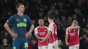 Arsenal makes winning return to Champions League by beating PSV Eindhoven in the rain
