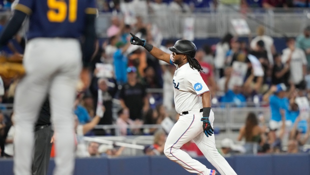 Berti homers twice in win as Marlins prevent Brewers from clinching NL Central