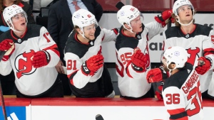 Hughes' three-point night leads Devils over Canadiens