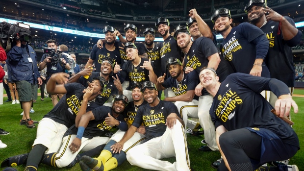 Brewers clinch third NL Central title in six seasons despite loss to Cards, get help from Braves