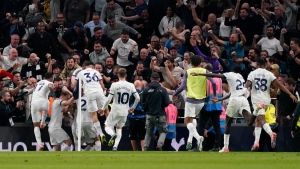 Matip's stoppage-time own-goal hands Tottenham win over defiant nine-man Liverpool