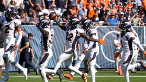 Wilson throws three TDs, Broncos rally from 21 down to top Bears