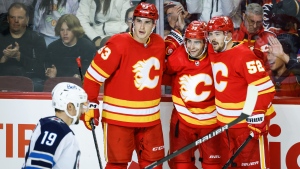 Flames rally from two-goal deficit to ground Jets