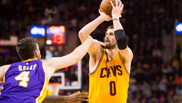 Kevin Love shoots over Ryan Kelly