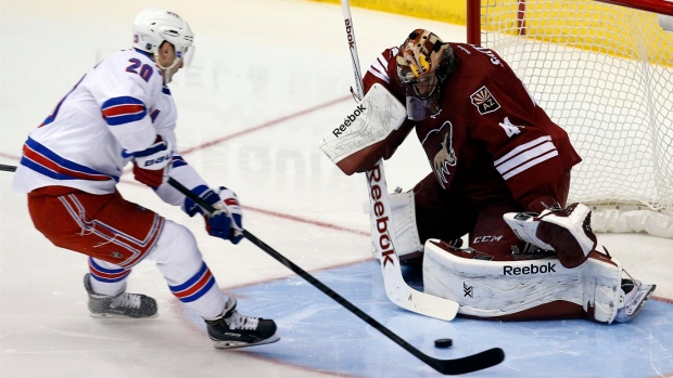 Chris Kreider scores on Mike Smith